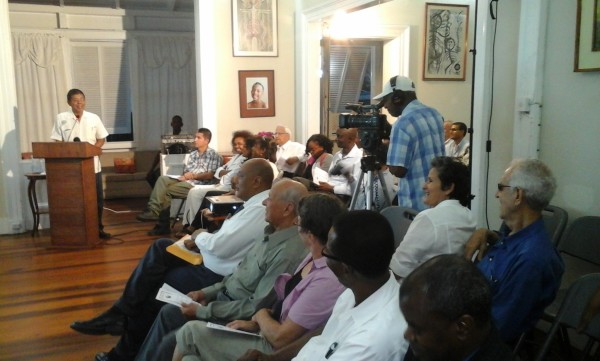 Stanley Ming at the podium and a section of the audience.